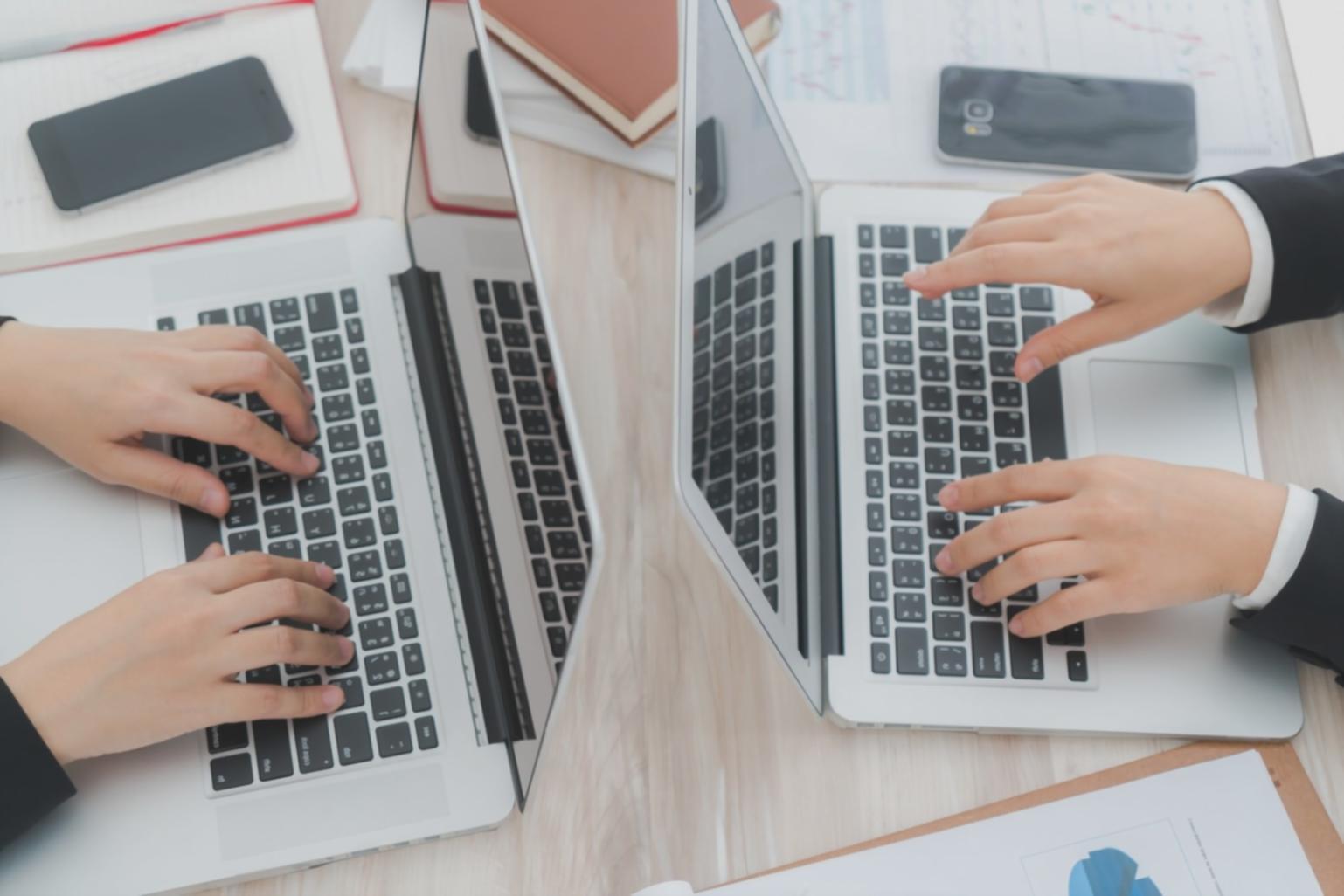 Participants working through cash flow budgeting exercises in collaborative setting