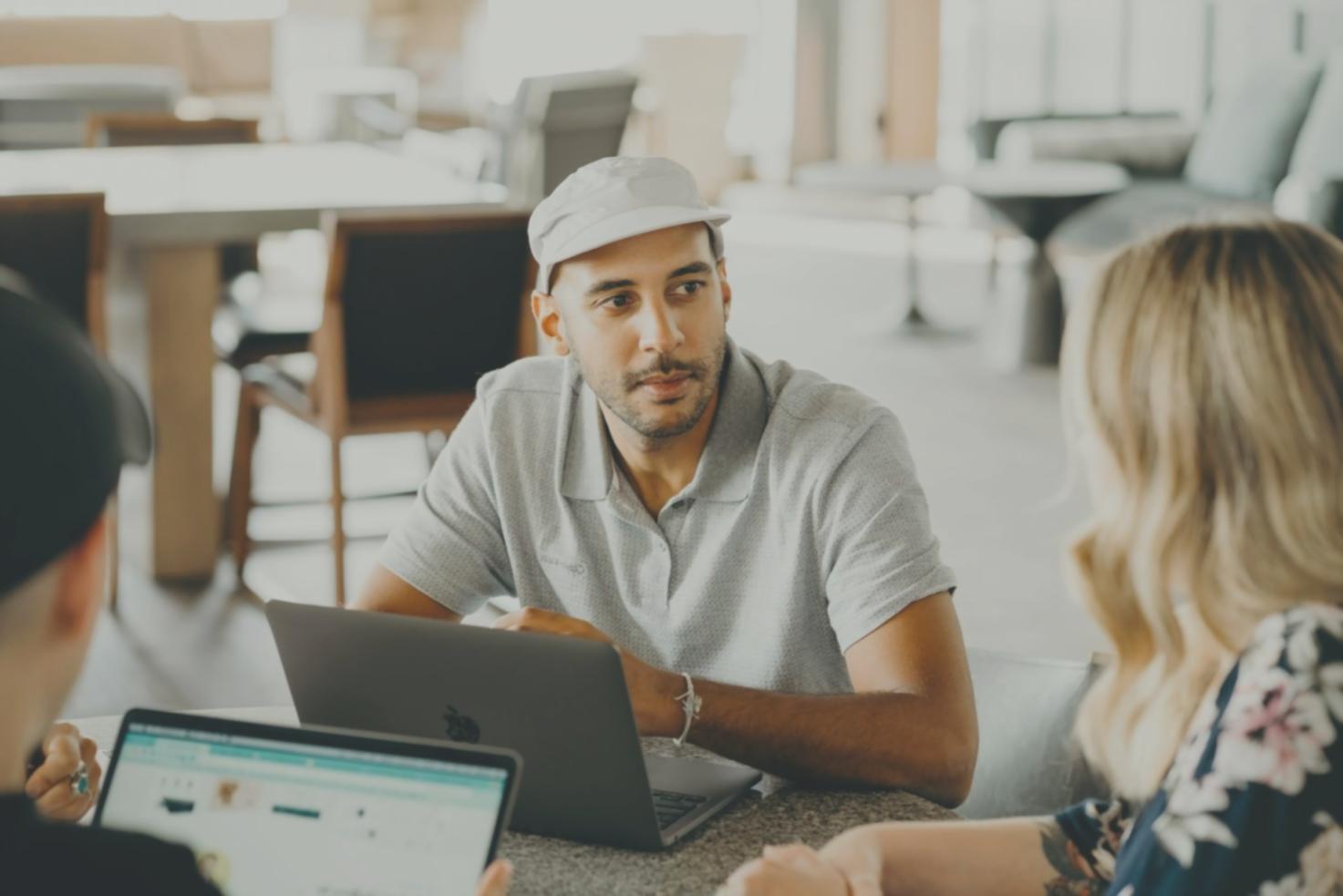 Person reviewing financial documents with notes and calculator